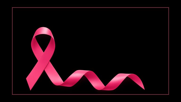 Ruban rose symbole d’Octobre Rose sur fond noir, campagne de sensibilisation au dépistage du cancer du sein